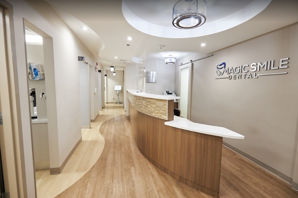 three staff members smiling